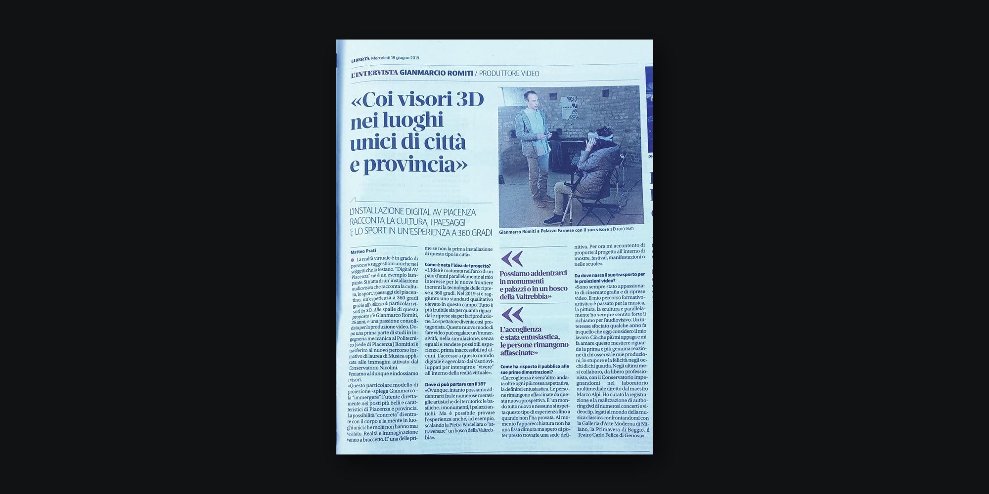 La pagina di Libertà del 19 giugno 2019 con l’intervista «Coi visori 3D nei luoghi unici di città e provincia» e la foto di Gianmarco Romiti a Palazzo Farnese accanto a una persona che prova il visore.